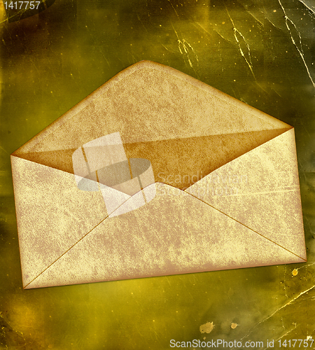 Image of vintage envelope on a grunge old paper