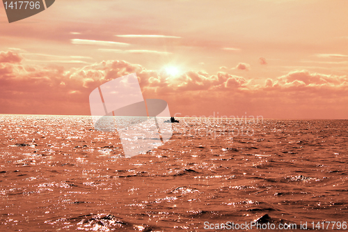 Image of fishing in the lake at sunset