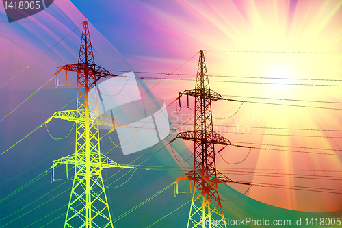 Image of electric power transmission towers at sunset 