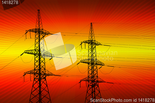 Image of electric power transmission towers at sunset 
