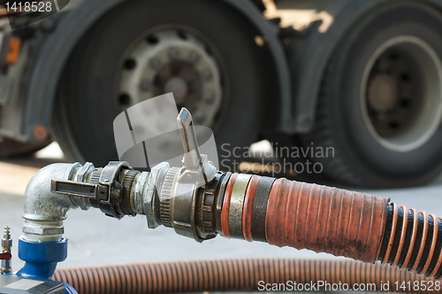 Image of Truck Hoses for fuel station, pumps and oil barrels