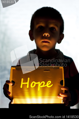 Image of Child and box shine light