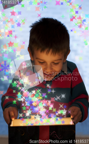 Image of Child peeping in a gift box