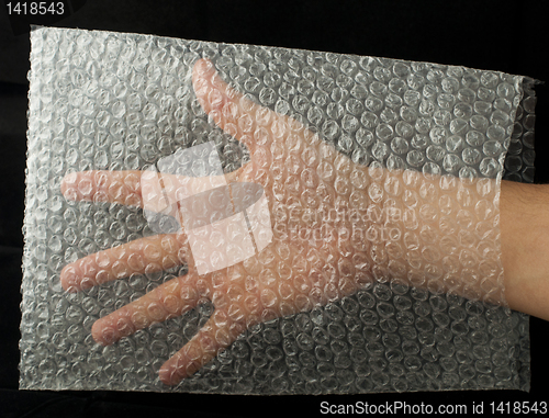 Image of Plastic bag and hand inside