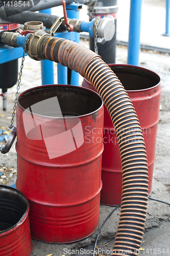 Image of Truck Hoses for fuel station, pumps and oil barrels
