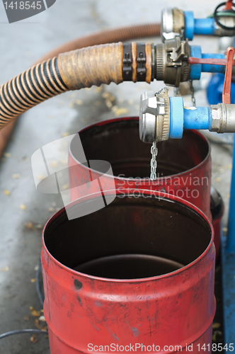 Image of Truck Hoses for fuel station, pumps and oil barrels