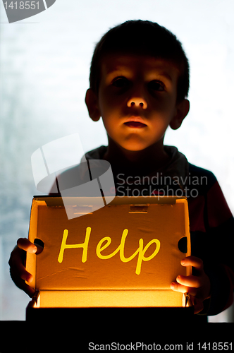 Image of Child and box shine light