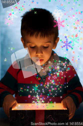 Image of Child peeping in a gift box