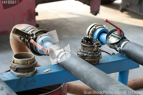 Image of Truck Hoses for fuel station, pumps and oil barrels