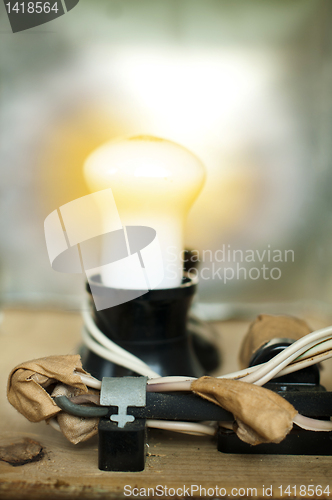 Image of Old electrical components, cables and lamp