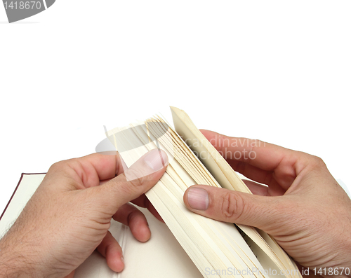 Image of hands and book