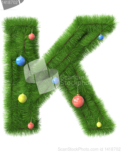 Image of K letter made of christmas tree branches