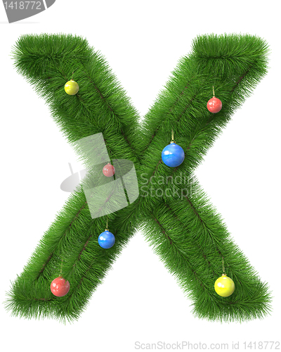 Image of X letter made of christmas tree branches