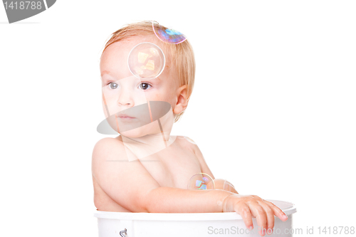 Image of Happy small boy having bath
