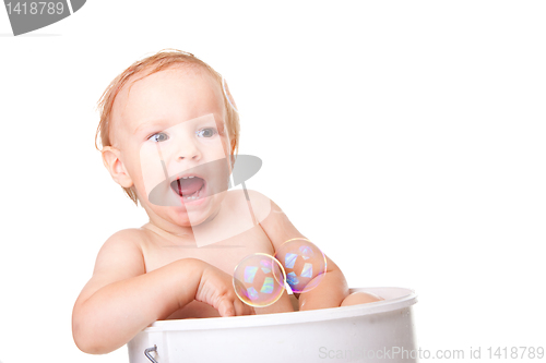Image of Happy small boy having bath