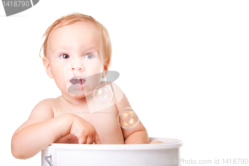 Image of Happy small boy having bath