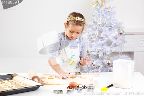 Image of Cute girl baking cookies