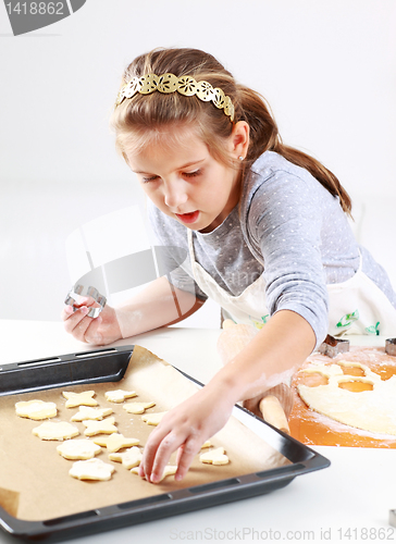 Image of Cute girl baking cookies