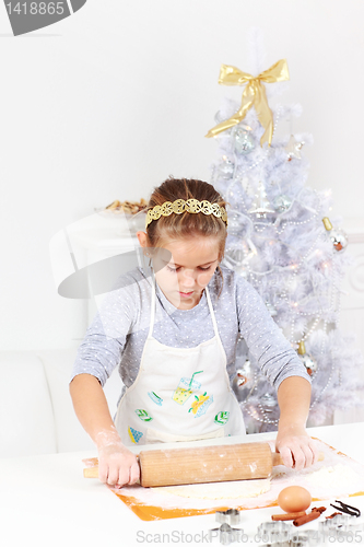 Image of Cute girl baking cookies