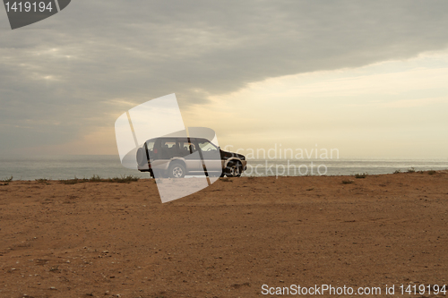 Image of Jeep on the beach.