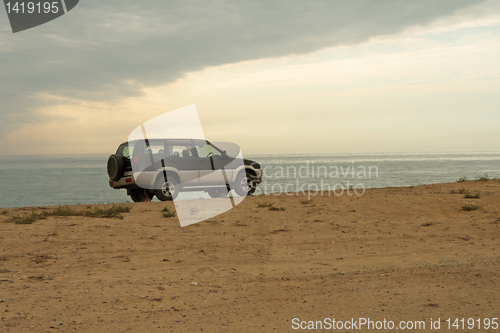 Image of Jeep on the beach.