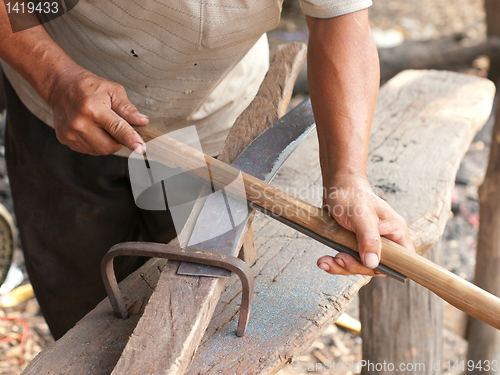 Image of Blacksmith sharpening a sickle