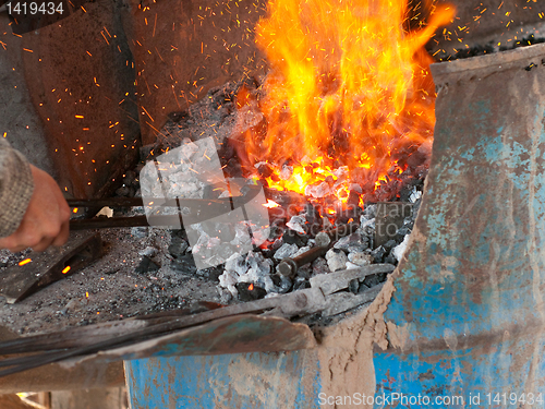 Image of Blacksmith working on an object