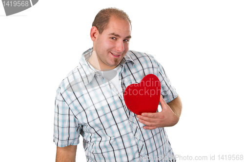 Image of Young man holding red heart