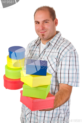 Image of Young man with colorful gift boxes