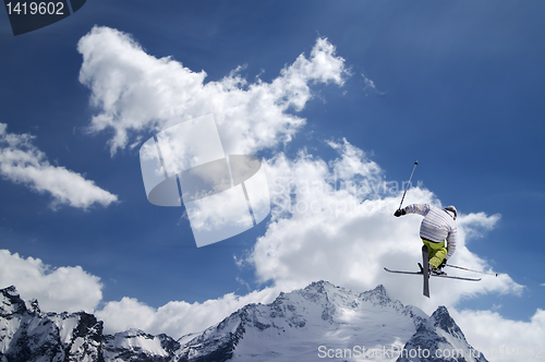 Image of Freestyle ski jumper with crossed skis