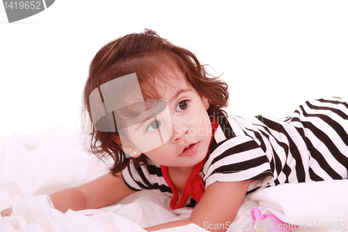 Image of baby girl lying on the bed with swimsuit with space for advertis