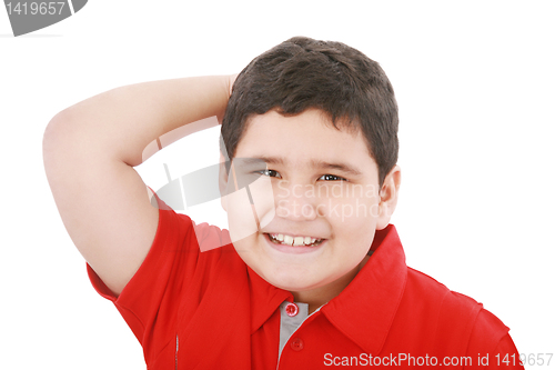 Image of Young boy looking up with hand between the hair 