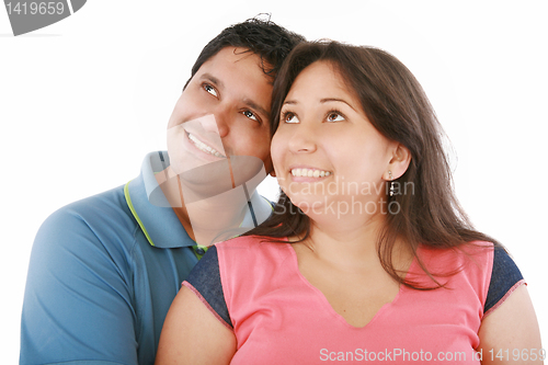 Image of Closeup portrait of a happy couple looking at something interest