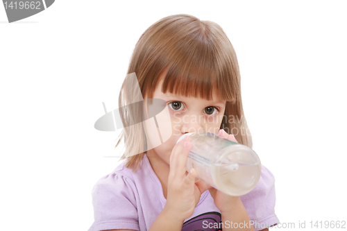 Image of Little girl drinking water of her bottle. White background 