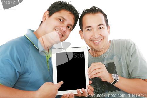 Image of Two young men or businessmen showing a tablet PC computer and sm