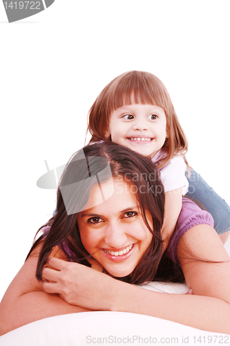 Image of mom and her little girl playing on pillow