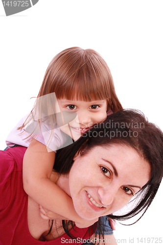 Image of Mother and daughter smiling into the camera lens