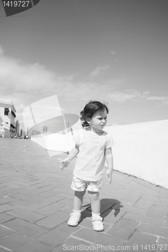 Image of Sad baby in a corridor missing her family