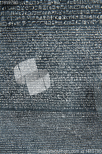 Image of old letters in the stone as history background