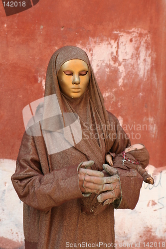 Image of venetian woman with mask and baby