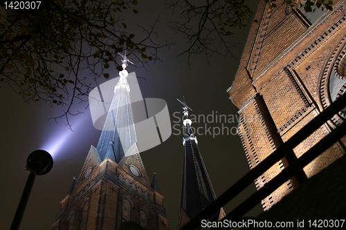 Image of Church with twin tower by night.