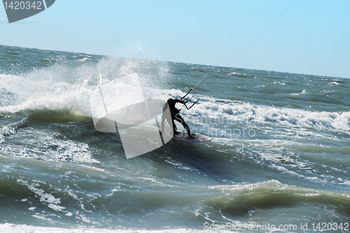 Image of Silhouette of kite surfer