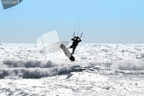 Image of Silhouette of kite surfer