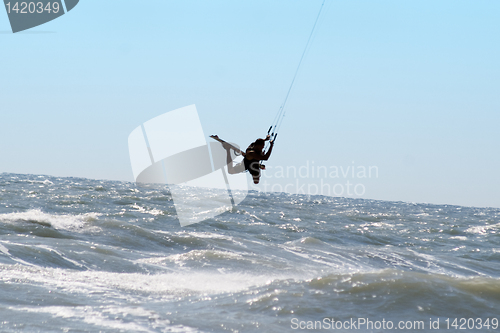 Image of Silhouette of kite surfer