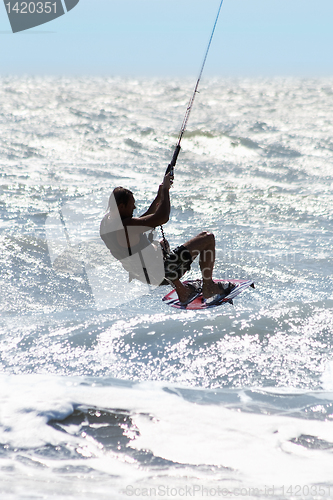 Image of Silhouette of kite surfer