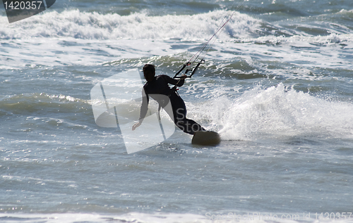 Image of Silhouette of kite surfer
