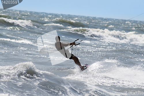 Image of Silhouette of kite surfer