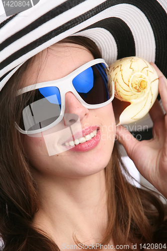 Image of beautiful girl with seashell