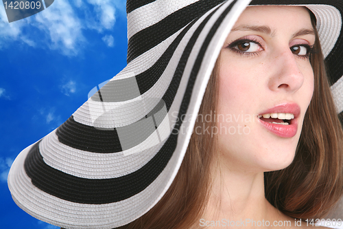 Image of beautiful girl in striped hat