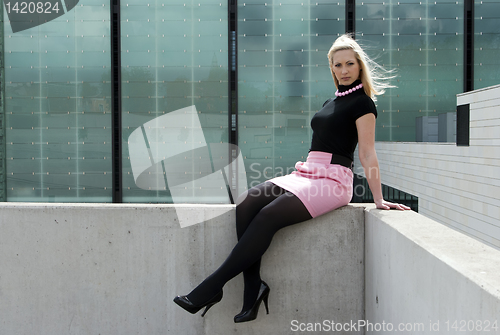 Image of blonde girl sitting